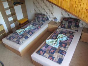 Łóżko lub łóżka w pokoju w obiekcie Pension U Vlášků