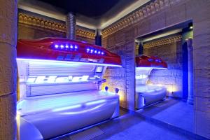 a room with two beds with lights in it at Pałac Saturna in Czeladź +64 photos