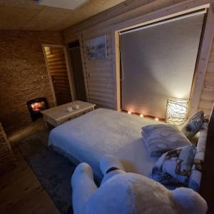 Ένα ή περισσότερα κρεβάτια σε δωμάτιο στο Žuvininkų pirtelė