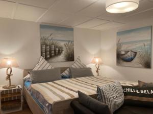En eller flere senge i et værelse på P11 Vakantiehuis