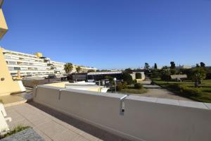 a view of a building from the roof of a building at Studio Naturiste "LE CACTUS" Coursives Port Nature 614 in Cap d'Agde