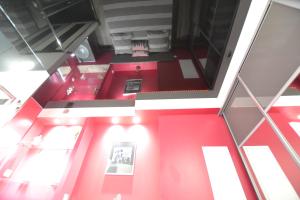 an overhead view of a room with red walls at Studio Naturiste "LE CACTUS" Coursives Port Nature 614 in Cap d'Agde +38 photos