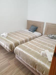 Postel nebo postele na pokoji v ubytování Urbanlux Lope de Vega