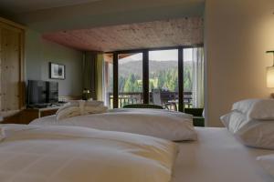 Postel nebo postele na pokoji v ubytování Hotel Gran Paradiso