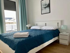 Posteľ alebo postele v izbe v ubytovaní Apartamenty Mieczysława Gorzki