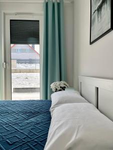 Posteľ alebo postele v izbe v ubytovaní Apartamenty Mieczysława Gorzki