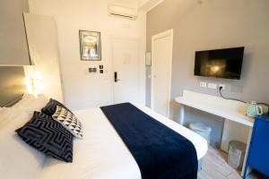 Letto o letti in una camera di Archi di Roma Guest House