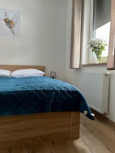 Posteľ alebo postele v izbe v ubytovaní Apartamenty Mieczysława Gorzki