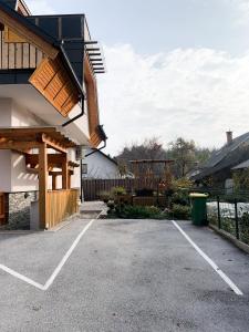 a parking lot in front of a house at Lovely basement rental in Bled