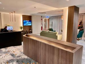 a lobby of a hotel with a reception desk at Stanton City Hotel in Kota Kinabalu