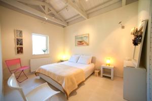 Postel nebo postele na pokoji v ubytování Villa Rodia + 16 fotografií