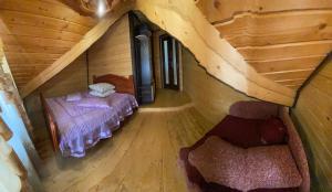 Ένα ή περισσότερα κρεβάτια σε δωμάτιο στο Plavianska Sadyba