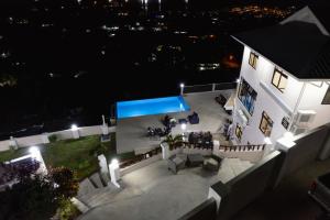 an aerial view of a house at night at Maison L'Horizon in De Quincey Village