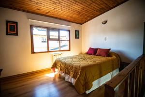 Cama ou camas em um quarto em Las Avutardas Hosteria