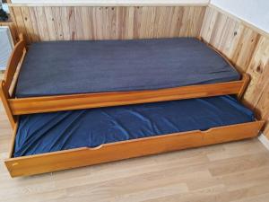 Cama o camas de una habitación en Spacieux appartement dans les hautes Vosges