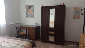 A bed or beds in a room at Etna, salvia e rosmarino