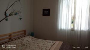 A bed or beds in a room at Etna, salvia e rosmarino