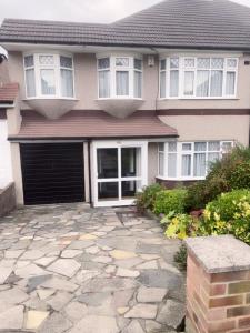 a house with a stone driveway in front of it at Bexleyhealth Town Center 5 Bedroom Luxurious Home in Bexleyheath