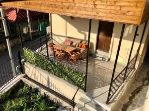 an overhead view of a patio with a table and chairs at Luxury Apartment at Pirosmani 22 in central Borjomi in Borjomi