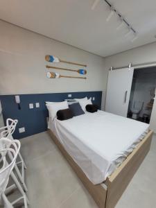Una cama o camas en una habitación de Flat Amarilis Apartamento 103