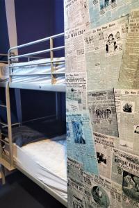 Postel nebo postele na pokoji v ubytování Gaslamp Hostel
