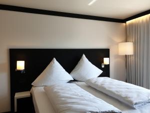 En eller flere senge i et værelse på GAG Hotel by WMM Hotels