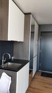 Kuchyň nebo kuchyňský kout v ubytování GAG Hotel by WMM Hotels