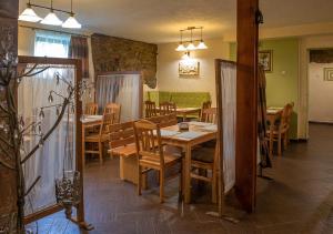a dining room with a table and chairs and a table and chairsktop at Villa Dom Julii in Sanok