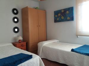 Posteľ alebo postele v izbe v ubytovaní Edificio Las Rocas