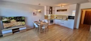 a kitchen with a table and chairs in a room at Sunset View in Kežmarok +10 photos