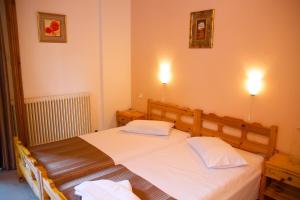 Postel nebo postele na pokoji v ubytování Stavroula Rooms