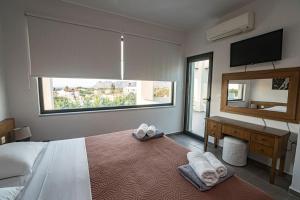 A bed or beds in a room at Villa Detoro
