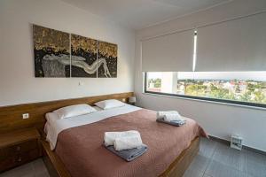 A bed or beds in a room at Villa Detoro
