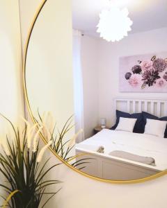 a bedroom with a mirror and a bed at Lovely apartment MIRA near Airport Zagreb in Velika Gorica