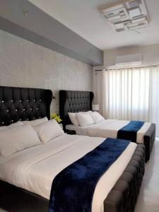 Ein Bett oder Betten in einem Zimmer der Unterkunft grace residence
