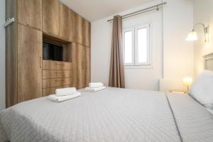 Posteľ alebo postele v izbe v ubytovaní Anius Apartments