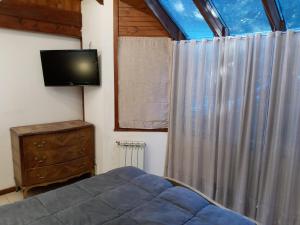TV a/nebo společenská místnost v ubytování Casa en Bariloche