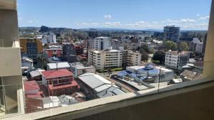 a view of a city from a window at Departamento Centro Osorno in Osorno