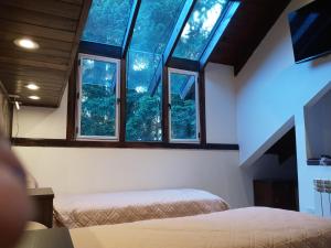 Postel nebo postele na pokoji v ubytování Casa en Bariloche