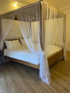 Postel nebo postele na pokoji v ubytování Domino Hotel