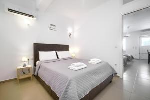 Posteľ alebo postele v izbe v ubytovaní Anius Apartments
