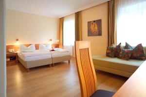 Hotel & Restaurant Ragginger Attersee客房内的一张或多张床位