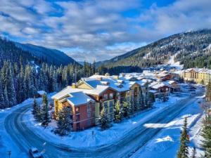 an aerial view of a resort in the snow at Beautiful true ski-in/out condo for family trip! in Sun Peaks