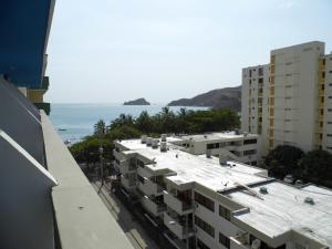an aerial view of buildings and the ocean at Hotel Betoma in Santa Marta