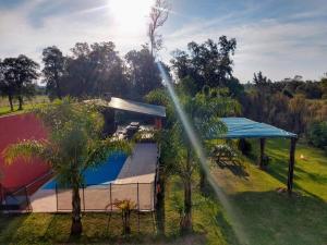 a view of a house with a playground at Apart del YERUA in Puerto Yeruá