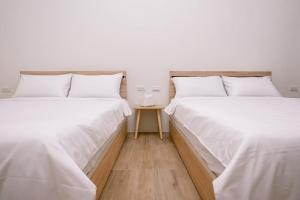Letto o letti in una camera di 澎湖逸軒居民宿
