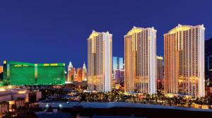 a group of tall buildings in a city at night at MGM Signature studio No resort fee in Las Vegas