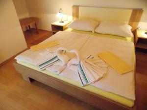 Postel nebo postele na pokoji v ubytování Apartments Smirnov