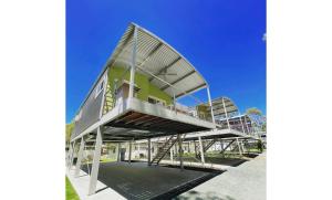 a house with a metal staircase leading up to it at BIG4 Deniliquin Holiday Park in Deniliquin