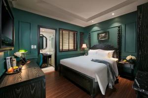 Voodi või voodid majutusasutuse Grande Collection Hotel & Spa toas